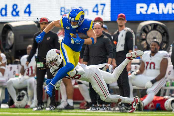 October 15, 2023; Inglewood, California, USA; Los Angeles Rams wide receiver Cooper Kupp (10) runs the football against Arizona Cardinals safety Andre Chachere (36) during the first quarter at SoFi Stadium.