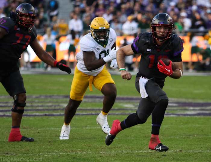 Josh Hoover runs it in for a touchdown.