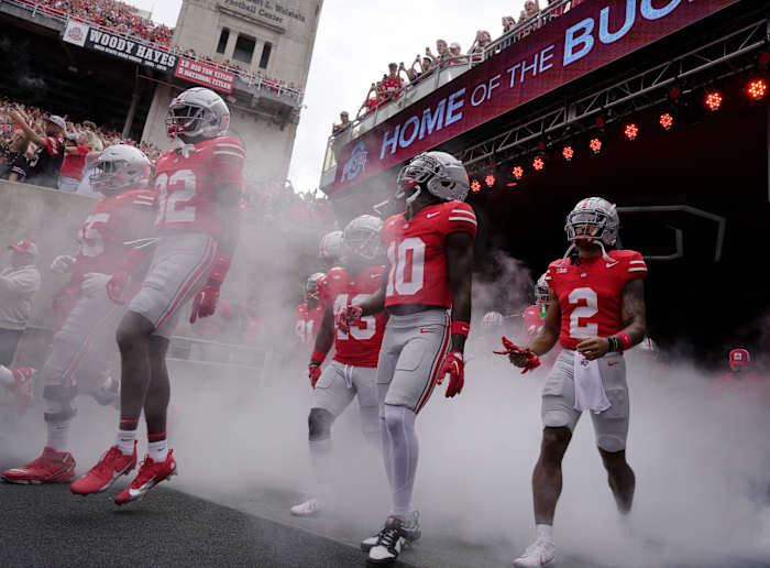 (l-r) Ohio State Buckeyes offensive lineman Matthew Jones (55), Ohio State Buckeyes safety Brenten Jones (32), Ohio State Buckeyes cornerback Denzel Burke (10) and Ohio State Buckeyes wide receiver Emeka Egbuka