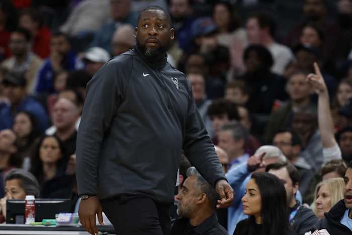 Milwaukee Bucks head coach Adrian Griffin looks on from the bench against the Washington Wizards 