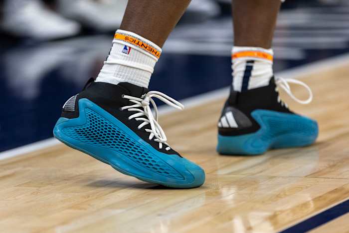 Minnesota Timberwolves guard Anthony Edwards' blue and black adidas shoes.