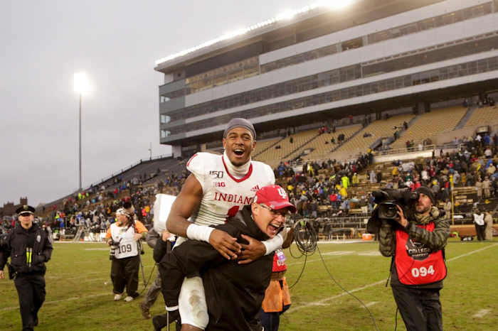 Indiana head coach Tom Allen carries Indiana wide receiver Whop Philyor (1) across the field after defeating Purdue, 44-41 in double overtime to win the Old Oaken Bucket, Saturday, Nov. 30, 2019 at Ross-Ade Stadium in West Lafayette.