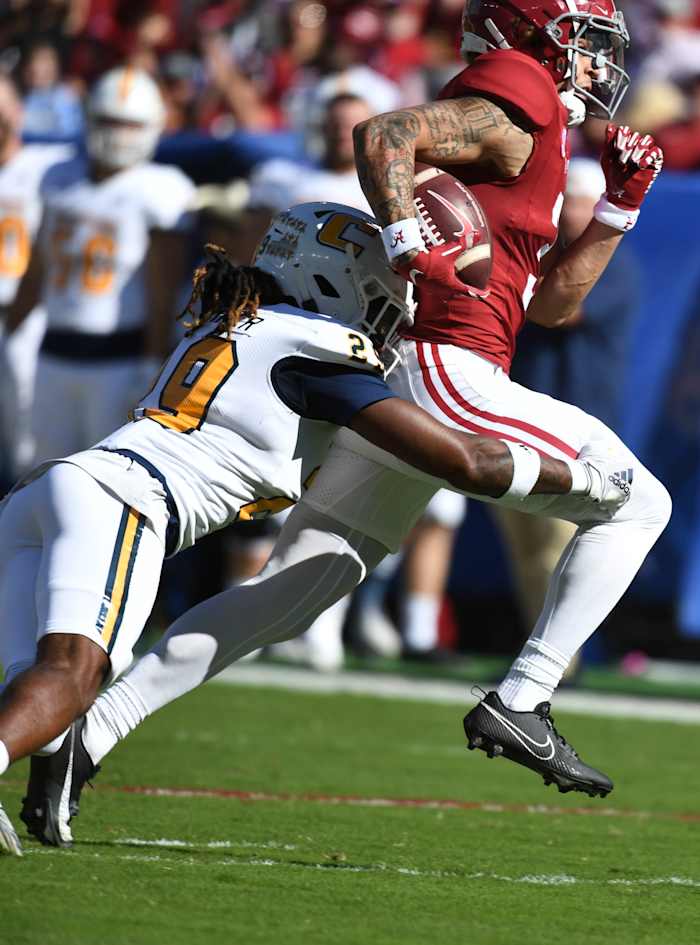 Nov 18, 2023; Tuscaloosa, Alabama, USA; Chattanooga Mocs defensive back Telly Plummer (29) tackles Alabama Crimson Tide wide receiver Jermaine Burton (3) after Burton made a catch over the middle at Bryant-Denny Stadium. Mandatory Credit: Gary Cosby Jr.-USA TODAY Sports