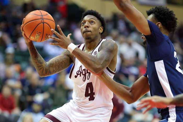 Nov 23, 2023; Kissimmee, FL, USA; Texas A&M Aggies guard Wade Taylor IV (4) drives to the hoop against the Penn State Nittany Lions in the second half during the ESPN Events Invitational at State Farm Field House.