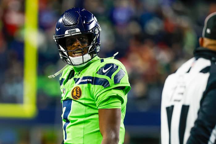 Seattle Seahawks quarterback Geno Smith (7) reacts towards a referee following a play against the San Francisco 49ers during the third quarter at Lumen Field.