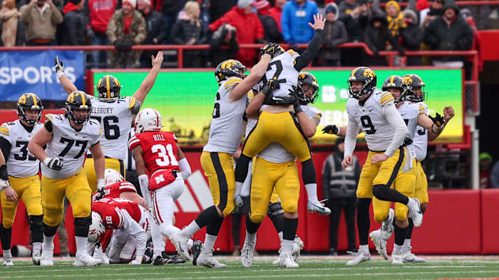 Iowa players celebrate a walk-off win over Nebraska on Black Friday (Nov. 23, 2023)