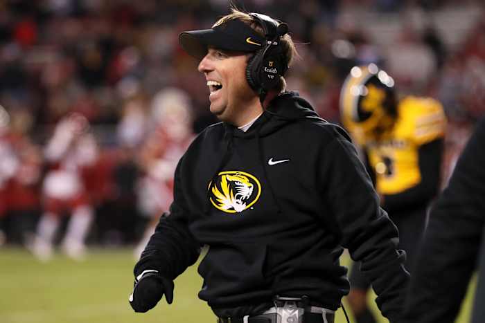 Nov 24, 2023; Fayetteville, Arkansas, USA; Missouri Tigers head coach Eli Drinkwitz celebrates after a defensive touchdown in the third quarter against the Arkansas Razorbacks at Donald W. Reynolds Razorback Stadium. Missouri won 48-14.