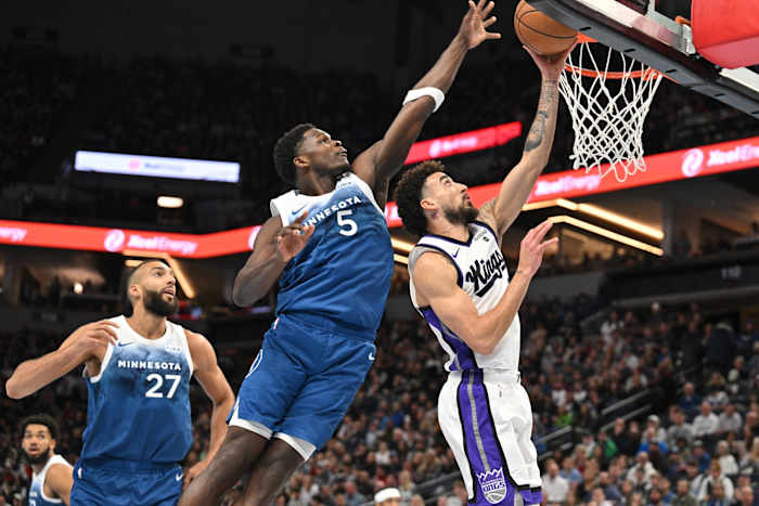 Nov 24, 2023; Minneapolis, Minnesota, USA; Minnesota Timberwolves guard Anthony Edwards (5) blocks the shot of Sacramento Kings guard Chris Duarte (3) as center Rudy