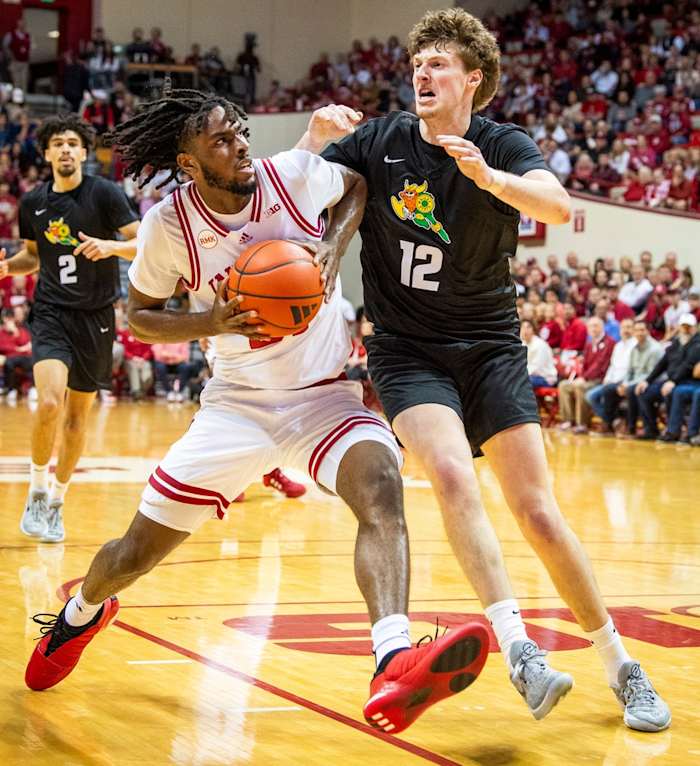 Indiana's Mackenzie Mgbako (21) drives against Wright State's AJ Braun (12) during the first half of the Indiana versus Wright State men's basketball game at Simon Skjodt Assembly Hall on Thursday, Nov. 16, 2023.