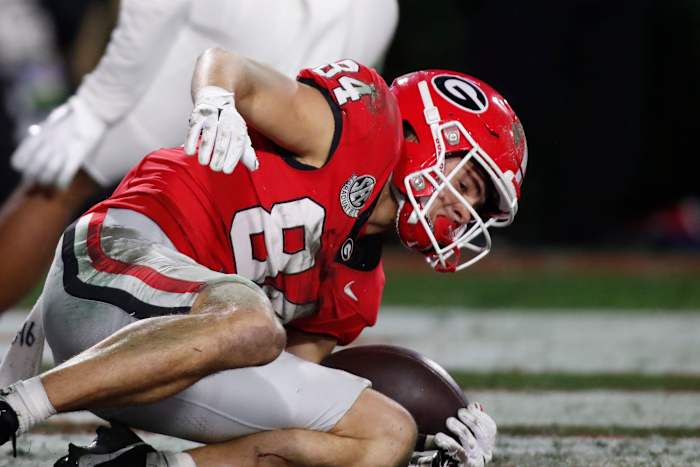 Georgia wide receiver Ladd McConkey (84) pulls in a pass from Georgia quarterback Carson Beck (15) for a touchdown during the first half of a NCAA college football game against Ole Miss in Athens, Ga., on Saturday, Nov. 11, 2023.