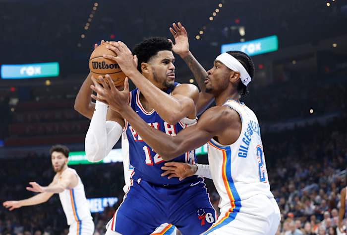 Nov 25, 2023; Oklahoma City, Oklahoma, USA; Oklahoma City Thunder guard Shai Gilgeous-Alexander (2) defends a drive by Philadelphia 76ers forward Tobias Harris (12) during the first quarter at Paycom Center.