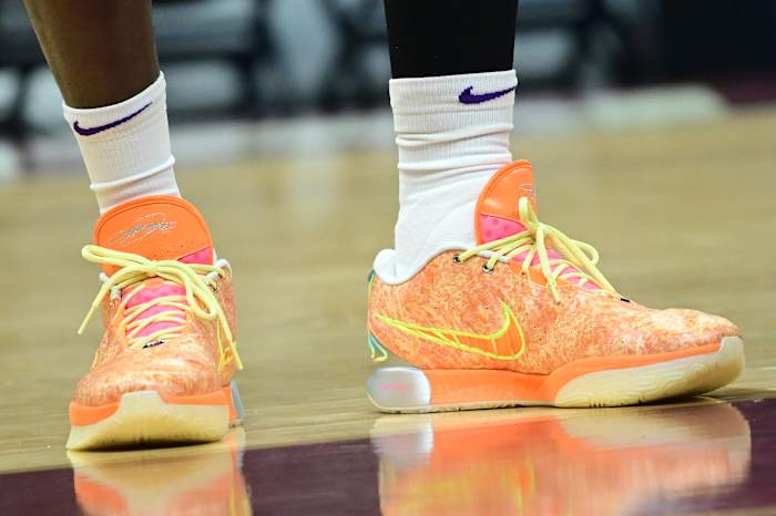 Los Angeles Lakers forward LeBron James' orange and yellow Nike sneakers.