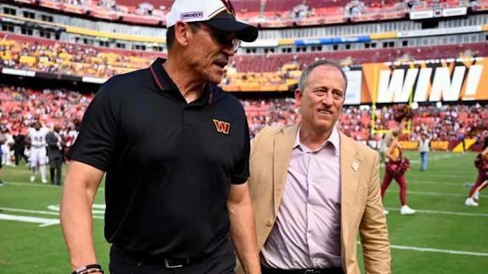 Josh Harris and Ron Rivera.