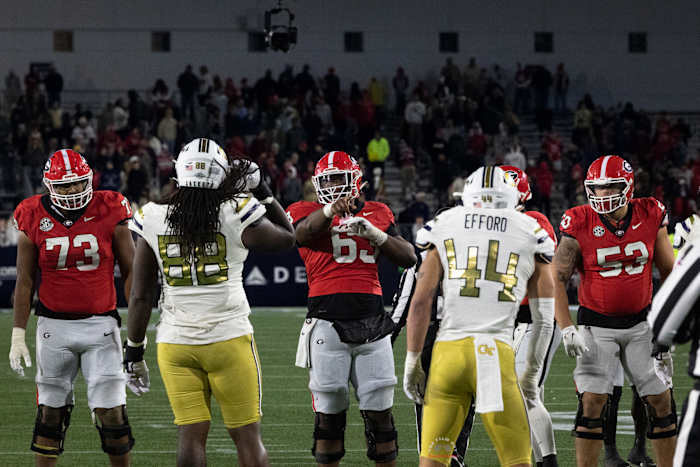 Georgia Bulldogs center (#63) Sedrick Van Pran Granger calling out blocking assignments during their rivalry game against Georgia Tech on Nov. 25, 2023. (Brooks Austin / Dawgs Daily.)