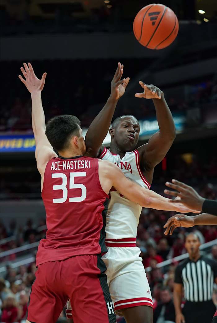 Indiana Hoosiers forward Payton Sparks (24) passes the ball around Harvard Crimson forward Luca Ace-Nasteski (35) during the game against Harvard in Gainbridge Fieldhouse.