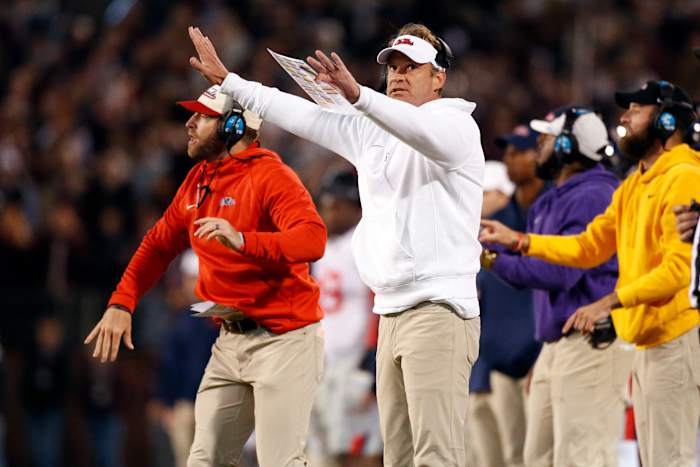 Nov 23, 2023; Starkville, Mississippi, USA; Mississippi Rebels head coach Lane Kiffin signals during the first half against the Mississippi State Bulldogs at Davis Wade Stadium at Scott Field. Mandatory Credit: Petre Thomas-USA TODAY Sports