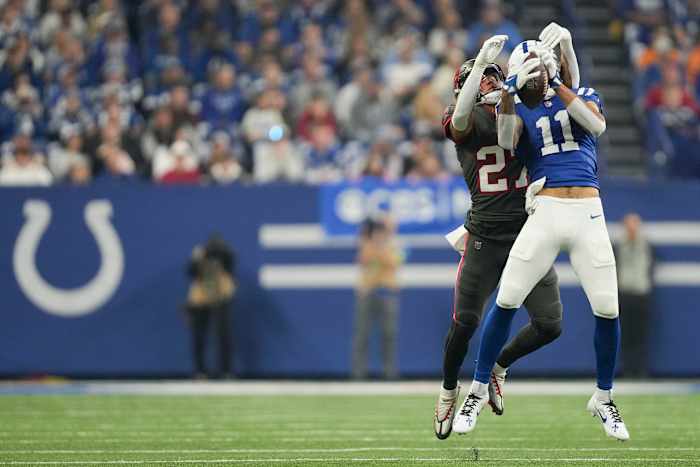 Indianapolis Colts wide receiver Michael Pittman Jr. (11) makes a catch in front of Tampa Bay Buccaneers cornerback Zyon McCollum (27) on Sunday, Nov. 26, 2023, during a game against the Tampa Bay Buccaneers at Lucas Oil Stadium in Indianapolis.