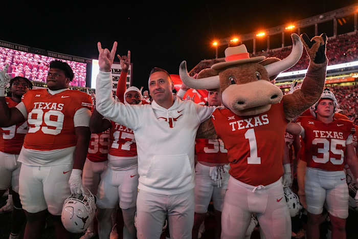 Texas Longhorns head coach Steve Sarkisian and Hook 'Em sing \"The Eyes of Texas\" following the game against Texas Tech at Darrell K Royal Texas Memorial Stadium on Friday, Nov. 24, 2023.