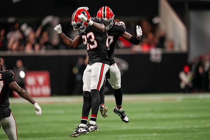 Nov 26, 2023; Atlanta, Georgia, USA; Atlanta Falcons defensive tackle Calais Campbell (93) and safety Richie Grant (27) react after defeating the New Orleans Saints at Mercedes-Benz Stadium.