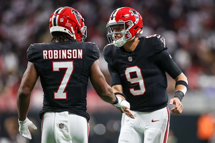 Atlanta Falcons running back Bijan Robinson (7) and quarterback Desmond Ridder (9).