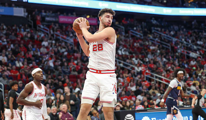 Rockets center Alperen Sengun grabs a rebound during the game against the Denver Nuggets at Toyota Center.