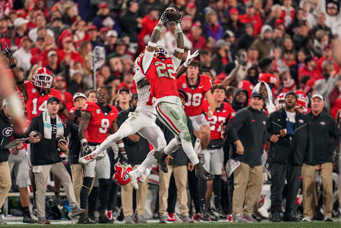 Nov 11, 2023; Athens, Georgia, USA; Georgia Bulldogs defensive back Javon Bullard (22) intercepts a pass over the top of Mississippi Rebels wide receiver Dayton Wade (19) during the first half at Sanford Stadium. Mandatory Credit: Dale Zanine-USA TODAY Sports
