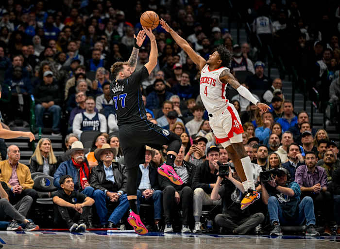 Dallas Mavericks guard Luka Doncic (77) shoots over Houston Rockets guard Jalen Green (4) during the second half at the American Airlines Center.