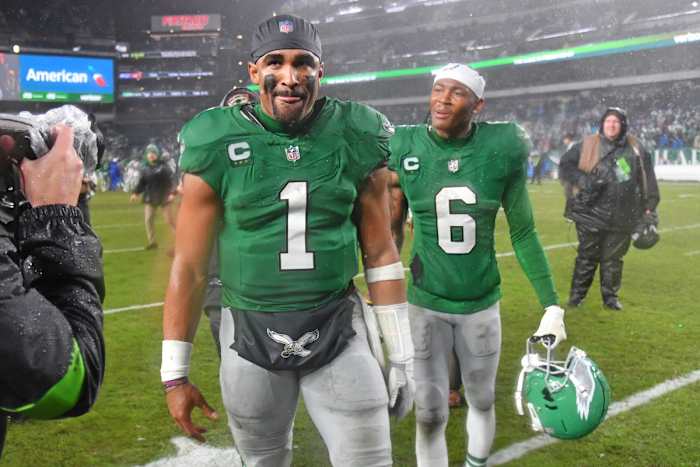 Nov 26, 2023; Philadelphia, Pennsylvania, USA; Philadelphia Eagles quarterback Jalen Hurts (1) snd wide receiver DeVonta Smith (6) walk off the field after overtime win against the Buffalo Bills at Lincoln Financial Field. Mandatory Credit: Eric Hartline-USA TODAY Sports  