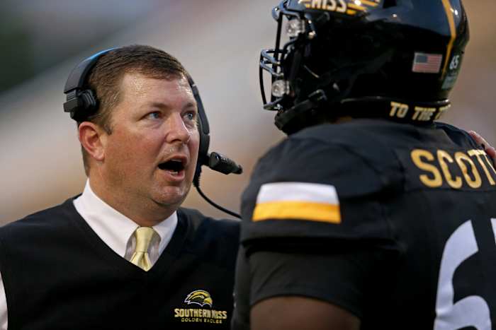 Gerquan Scott (right) with Southern Miss head coach Will Hall.