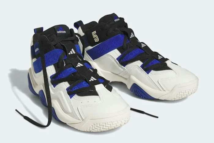 Side view of blue, black, and white adidas sneakers.