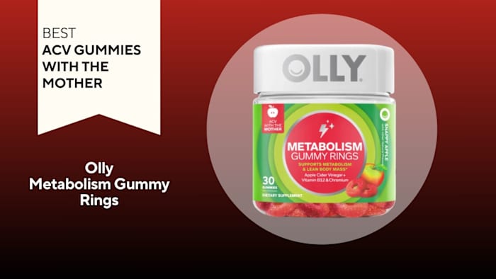 Clear container with a green label on the outside that says "metabolism gummy rings" and red gummies on the inside, against a red backgound.