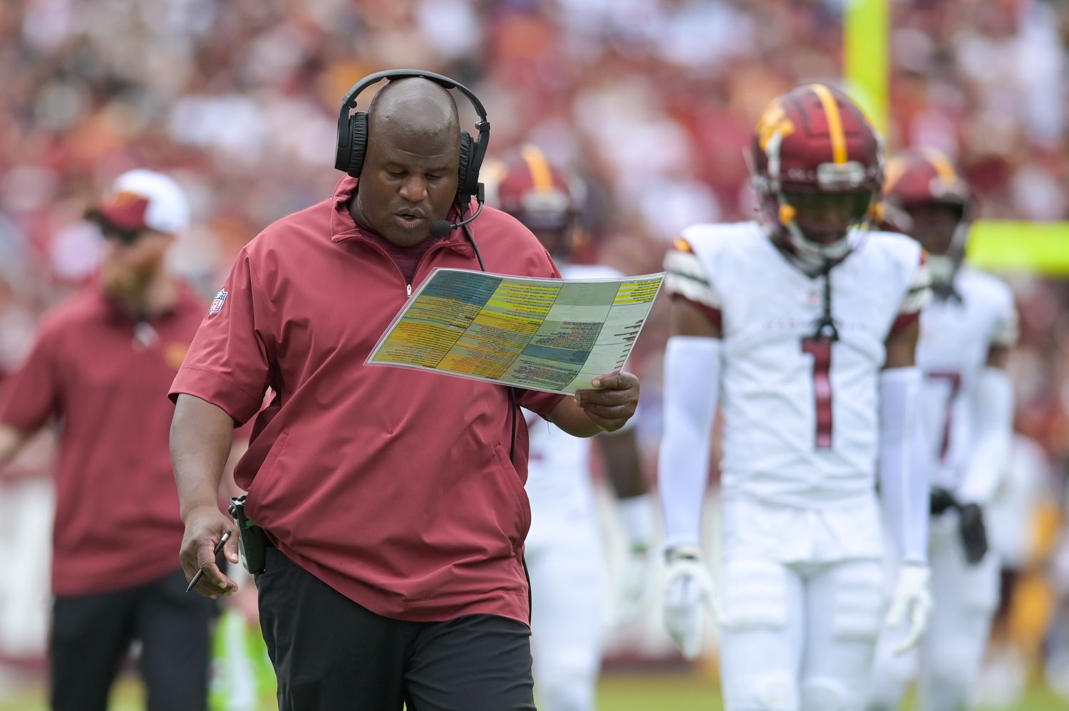 Washington Commanders assistant head coach/offensive coordinator Eric Bieniemy walks down the sidelines during the first half against the Arizona Cardinals at FedExField.