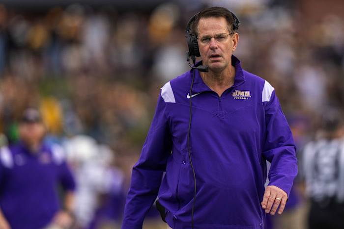 James Madison Dukes head coach Curt Cignetti walks the sideline during a game against the Appalachian State Mountaineers at Kidd Brewer Stadium.