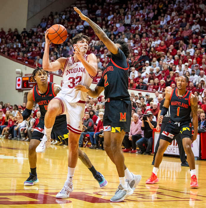 Indiana University's Trey Galloway (32 shoots over Maryland's Jahari Long (2) during the first half of the Indiana versus Maryland men's basketball game at Simon Skjodt Assembly Hall on Friday, Dec. 1, 2023.