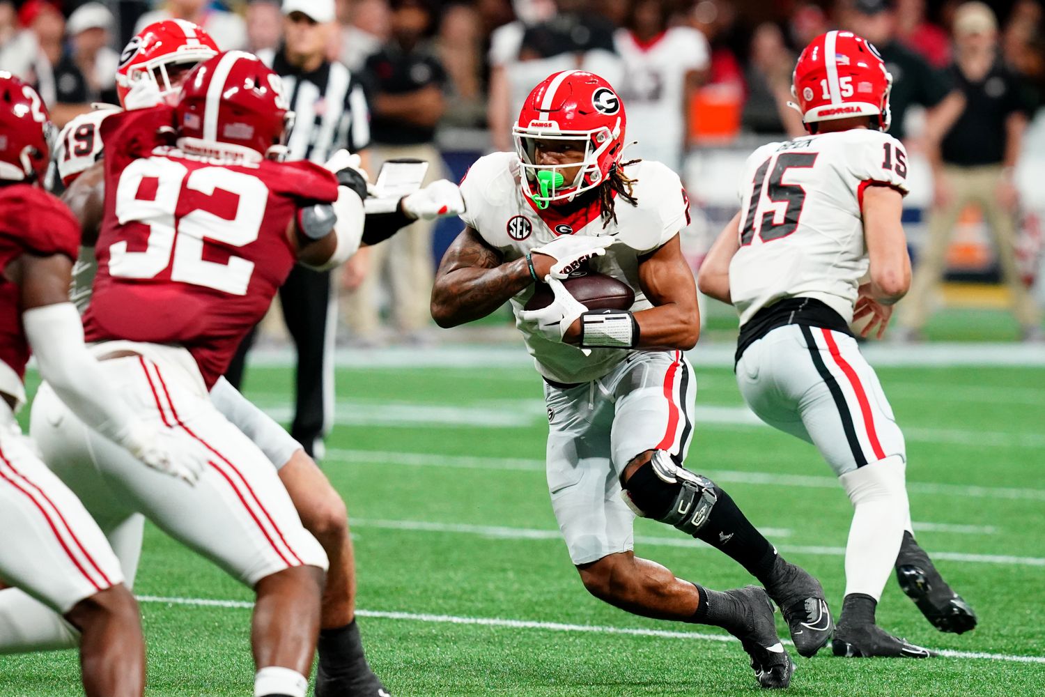 Dec 2, 2023; Atlanta, GA, USA; Georgia Bulldogs running back Kendall Milton (2) runs the ball in the second quarter against the Alabama Crimson Tide in the SEC Championship at Mercedes-Benz Stadium. Mandatory Credit: John David Mercer-USA TODAY Sports