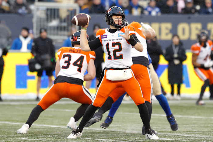 Nov 13, 2022; Winnigeg, Manitoba, CAN; BC Lions quarterback Nathan Rourke (12) gets set to make a pass against the Winnipeg Blue Bombers at Investors Group Field. Mandatory Credit: James Carey Lauder-USA TODAY Sports