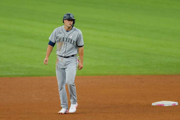 May 9, 2021; Arlington, Texas, USA; Seattle Mariners first baseman Evan White (12) leads off from second base during the fifth inning against the Texas Rangers at Globe Life Field. Mandatory Credit: Andrew Dieb-USA TODAY Sports