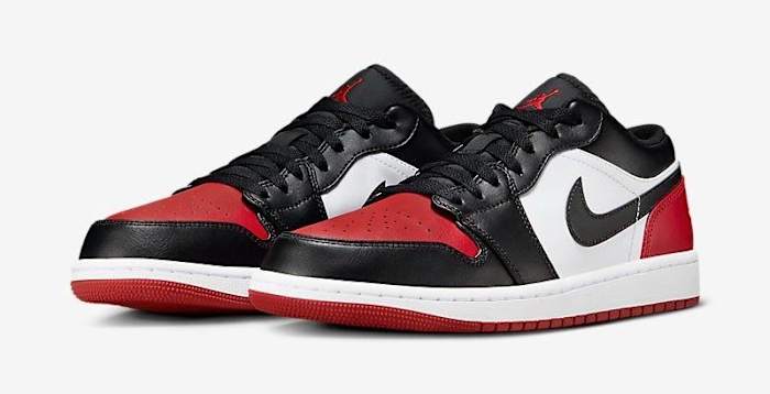 Side view of red and black Air Jordan sneakers.