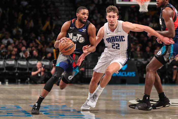 Brooklyn Nets forward Mikal Bridges (1) drives past Orlando Magic forward Franz Wagner (22) in the third quarter at Barclays Center.