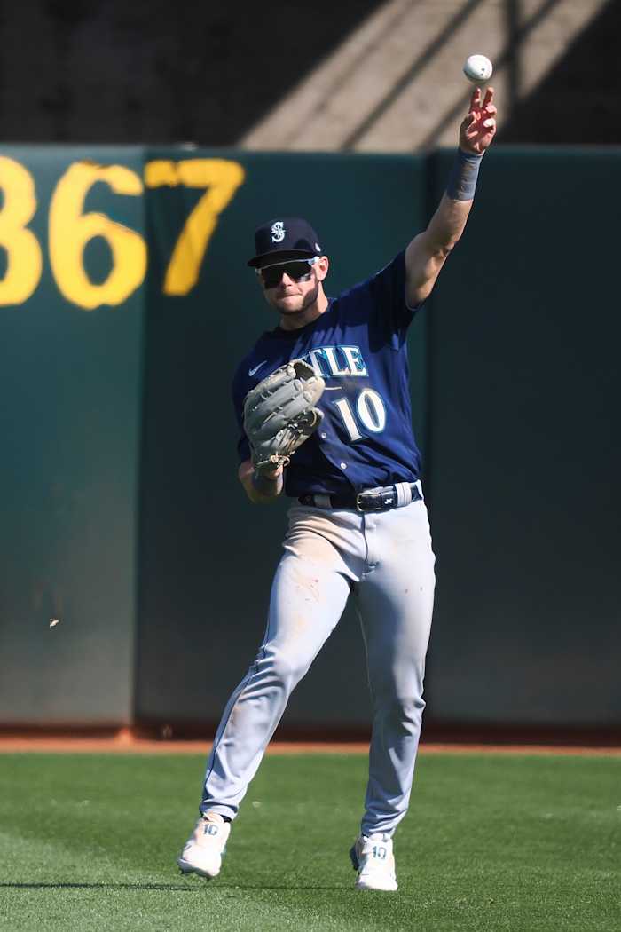 Sep 20, 2023; Oakland, California, USA; Seattle Mariners left field Jarred Kelenic (10) throws the ball during the ninth inning against the Oakland Athletics at Oakland-Alameda County Coliseum.