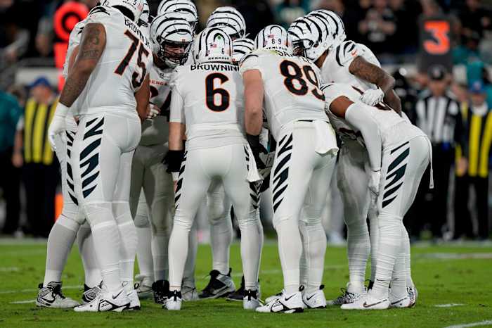 Cincinnati Bengals quarterback Jake Browning (6) huddles with his team as they face the Jacksonville Jaguars at EverBank Stadium in Jacksonville, Florida Monday, December 4, 2023.