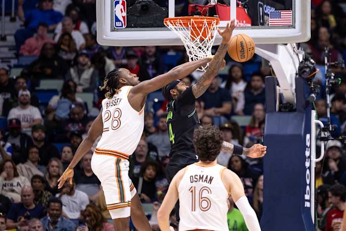 Charles Bassey blocks New Orleans' Brandon Ingram at the rim.