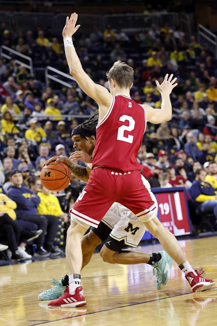 Michigan Wolverines guard Dug McDaniel (0) dribbles against Indiana Hoosiers guard Gabe Cupps (2) in the first half at Crisler Center.
