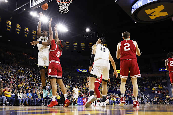 Michigan Wolverines forward Olivier Nkamhoua (13) shoots against Indiana Hoosiers forward Malik Reneau (5).