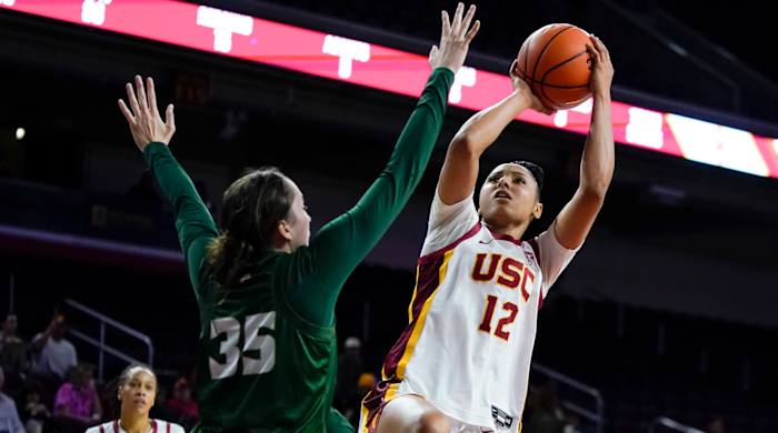 USC guard JuJu Watkins shoots against Cal Poly forward Natalia Ackerman.
