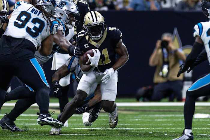 Jan 8, 2023; New Orleans Saints running back Alvin Kamara (41) gets past Carolina Panthers defensive tackle Bravvion Roy (93). Mandatory Credit: Stephen Lew-USA TODAY Sports