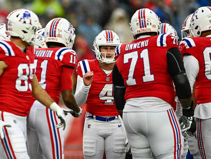 New England Patriots QB Bailey Zappe leads the huddle