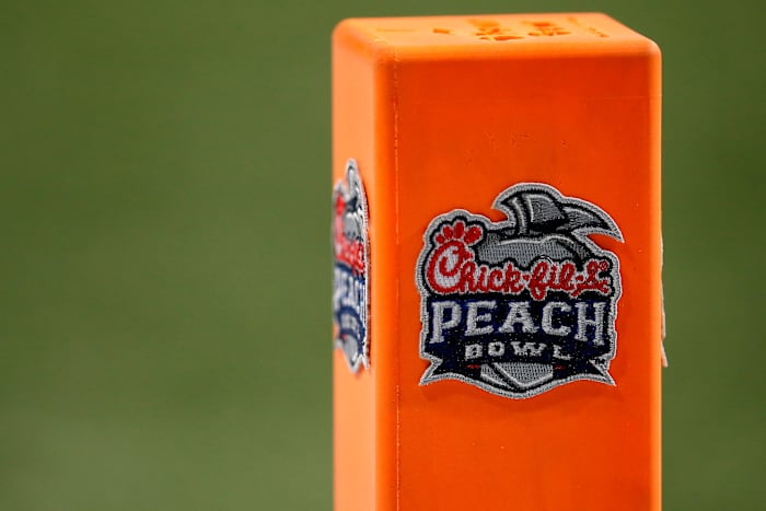 Pylons carry the Peach Bowl logo in the end zone during the third quarter of the Chick-fil-a Peach Bowl at Mercedes-Benz Stadium in Atlanta on Friday, Jan. 1, 2021. A last-minute field goal sealed a 24-21 win for the Bulldogs, leaving the Bearcats 9-1 on the season. Cincinnati Bearcats Vs Georgia Bulldogs Peach Bowl