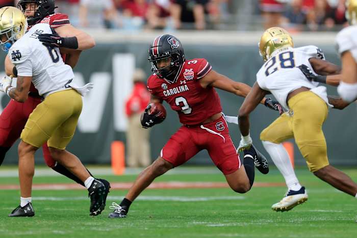 South Carolina Gamecocks wide receiver Antwane Wells Jr. (3) rushes for yards against Notre Dame Fighting Irish cornerback TaRiq Bracy (28) during the first quarter of the TaxSlayer Gator Bowl of an NCAA college football game Friday, Dec. 30, 2022 at TIAA Bank Field in Jacksonville. The Notre Dame Fighting Irish held off the South Carolina Gamecocks 45-38. [Corey Perrine/Florida Times-Union] Jki 123022 Ncaaf Nd Usc Cp 71  