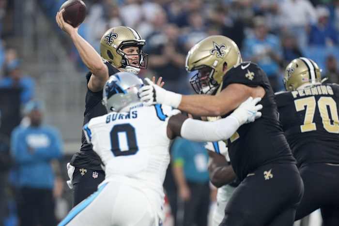 New Orleans Saints quarterback Derek Carr (4) is pressured by Carolina Panthers linebacker Brian Burns (0). Mandatory Credit: Jim Dedmon-USA TODAY